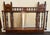 This listing is for an antique English Edwardian mirror. The mirror is made from wood. It features a Moorish inspired...