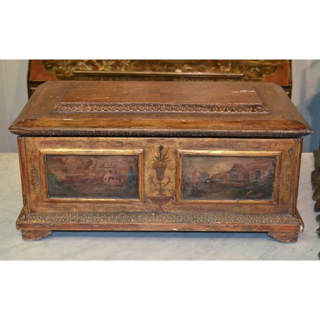 Marvelous and rare sized hand-carved Italian coffer circa 1800. Having lovely hand-painted landscape scenes, acanthus leaf...