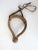 Vintage circa 1960's handmade braided rawhide bosal with headstall. Rawhide core, wrapped nose section. Minor overall wear.