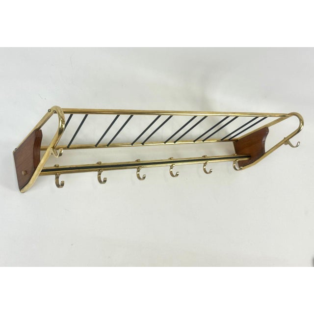 Mid-Century Teak and Brass Coat Rack, 1950s, in Flawless conditions. Designed 1950 to 1959