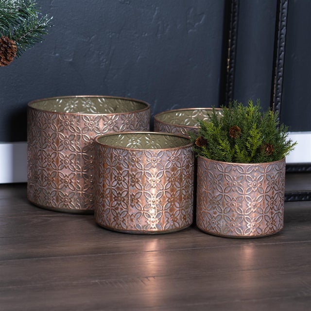 Elevate your plant display with this stunning Set of Ornate Geometric Metal Planters. Featuring a sophisticated distressed...