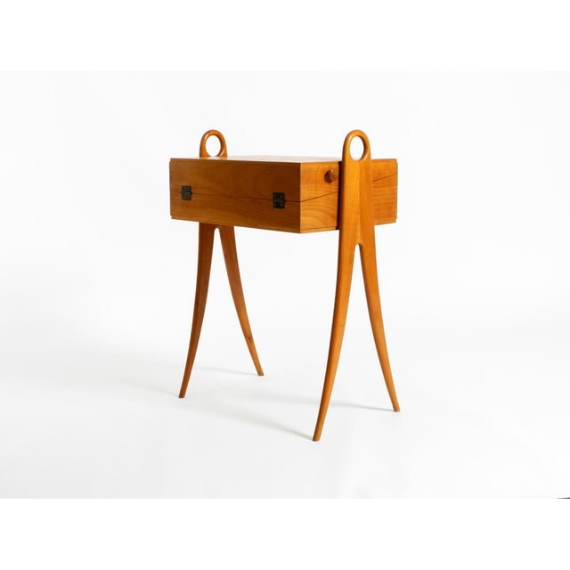 A beautiful, minimalist, original mid-century sewing box with a hinged top. Made in Germany from ash wood during the...