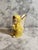 A charming secretive ceramic angel/cherub figurine is in a yellow jumpsuit. Sweet wings are handpainted with gold accents....