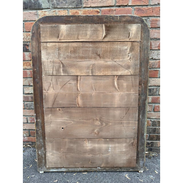 This exquisite Antique Louis Philippe Mirror, adorned with a gilded finish, effortlessly brings timeless charm to any...