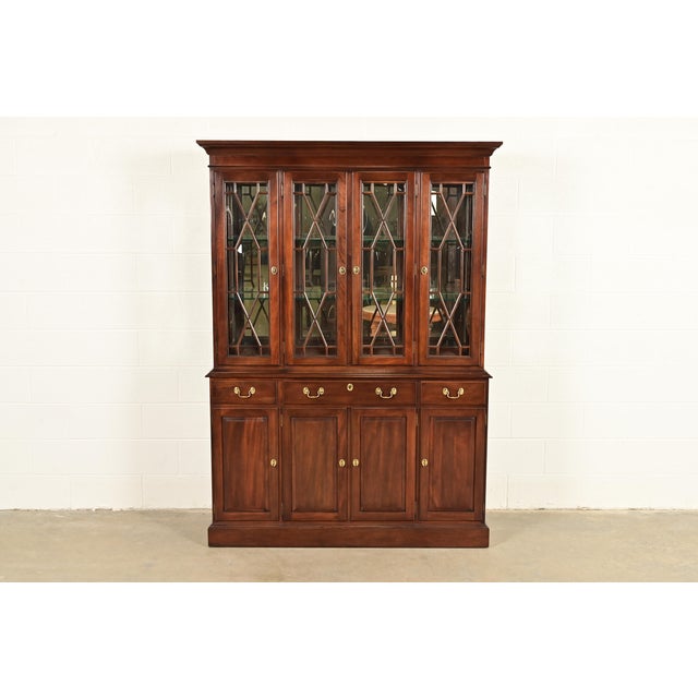 A beautiful Georgian or Chippendale style lighted breakfront bookcase cabinet or dining cabinet By Ethan Allen, "Knob...
