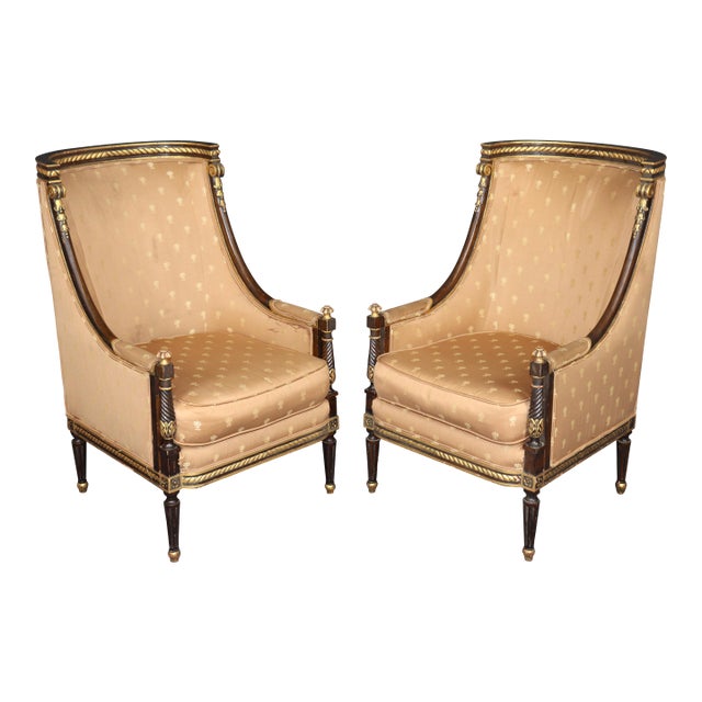 Pair Louis XVI Style Carved With Gilt Accent Wing Back Bergère Chairs For Sale