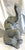 Adorable vintage elephant statue from the late 20th century. The sitting elephant has an uplifted trunk symbolizing good...