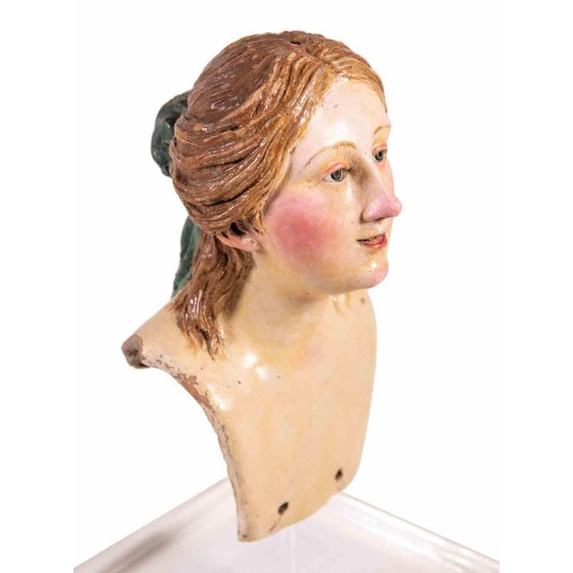 Head of woman man realized in polychrome ceramic with glass eyes. Neaples, 18th Century. Very good condition.