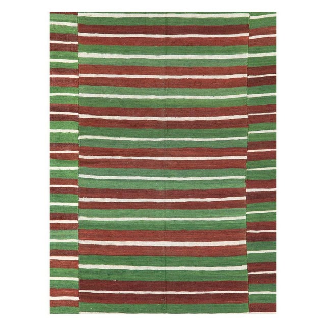A vintage Turkish flat-weave Kilim room size accent rug handmade during the mid-20th century. Measures: 5' 5" x 8' 7".
