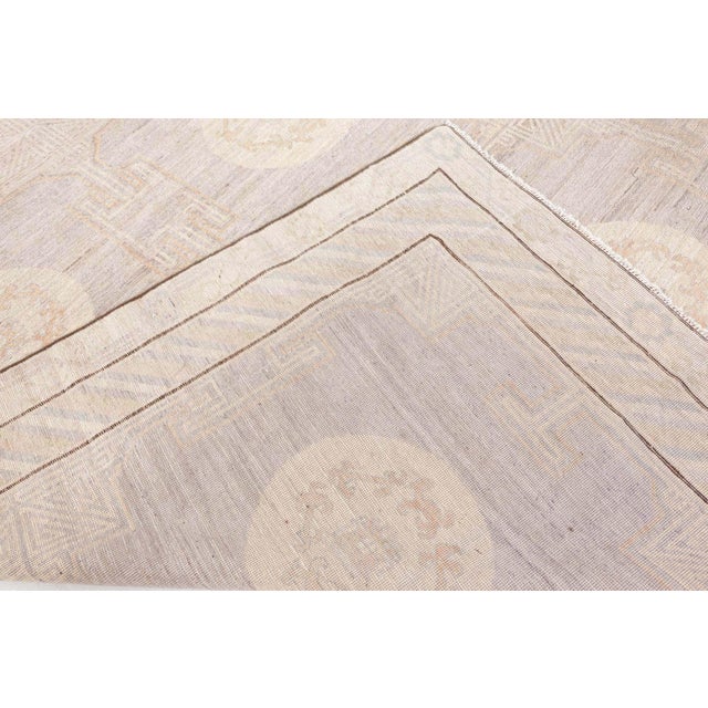 Khotan rugs were originally produced in East Turkestan and are interchangeably referred to as Samarkand rugs due to their...