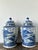 Make a commanding statement in your interior with this spectacular pair of monumental vintage porcelain temple jars....