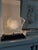 Art Deco lamp from the 1920s - 1930s, featuring a woman's profile with flowers and a black marble base. This lamp is in...