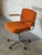 This ergonomic swivel office desk chair features a bentwood shell back with padded seating and chrome armrests. Its five-...