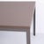 Danish design dining table made with steel legs and a tabletop with a grey linoleum surface. The table has a simple and...