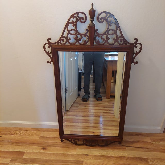 Elevate your entryway, dining room, or living space with this exceptional vintage Chippendale-style wall mirror by...