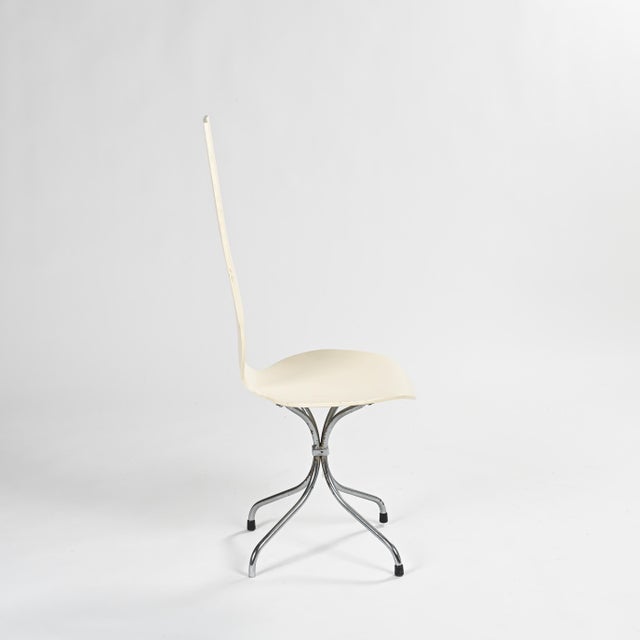 Pair of M352 model chairs, known as the "Lyre" chairs, designed in 1968 by Swiss designer Theo Häberli. Their molded and...