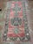 Vintage Turkish runner, hand-knotted in Turkey from 100% wool. Measuring 4’11” x 12’2”, the rug features a traditional...