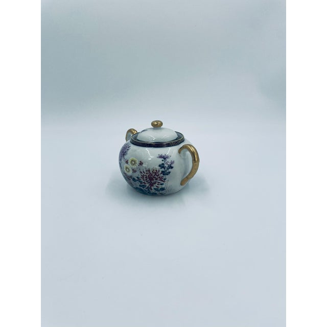 Japanese sugar bowl in the Kutania style, made of high-quality white porcelain. The sugar bowl has a matching lid and two...