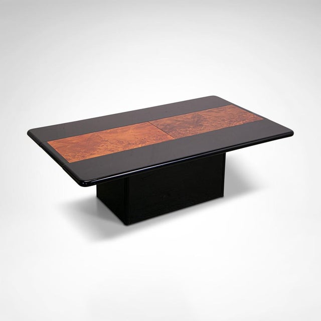 Black lacquered high gloss wood and burl wood in the manner of Eric Maville and Paul Michel. Of unknown origin but...