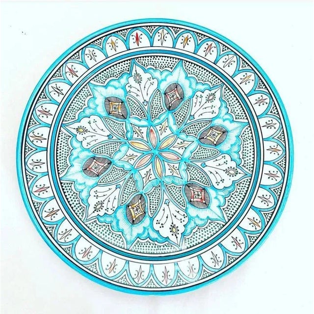 A Moroccan porcelain dish handmade in the Moroccan city of ESFI, famous for its clay and porcelain craftsmanship These...