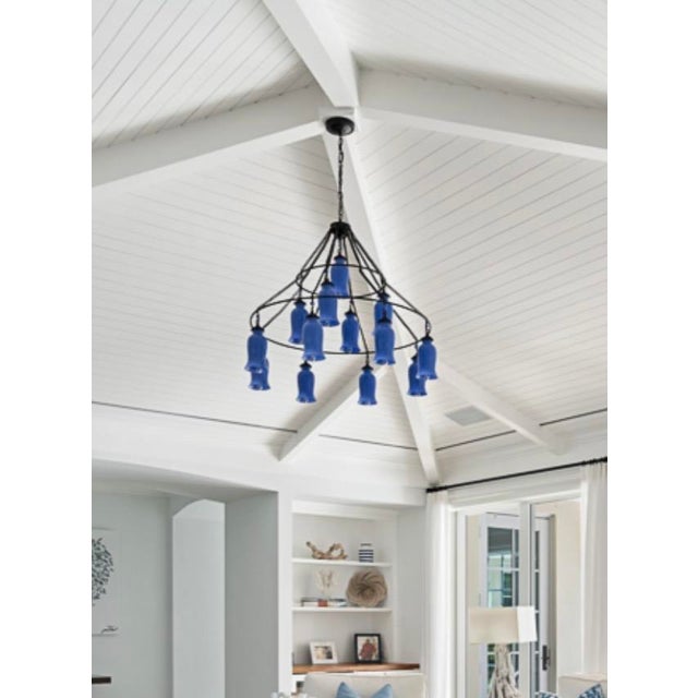 The Sara chandelier by Canopy Designs, is composed of two hanging metal rings adorned with milk glass shades. A stunning...