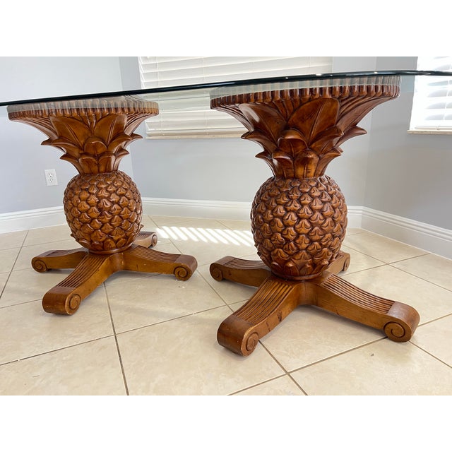 This unique glass top table features 2 pineapple-shaped pedestal bases. Oval glass top measures 72” X 42” Two Palm Tree...