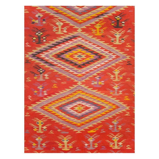 A vintage Turkish flatwoven Kilim large room size rug handmade during the mid-20th century. Measures: 12' 4" x 14' 5".