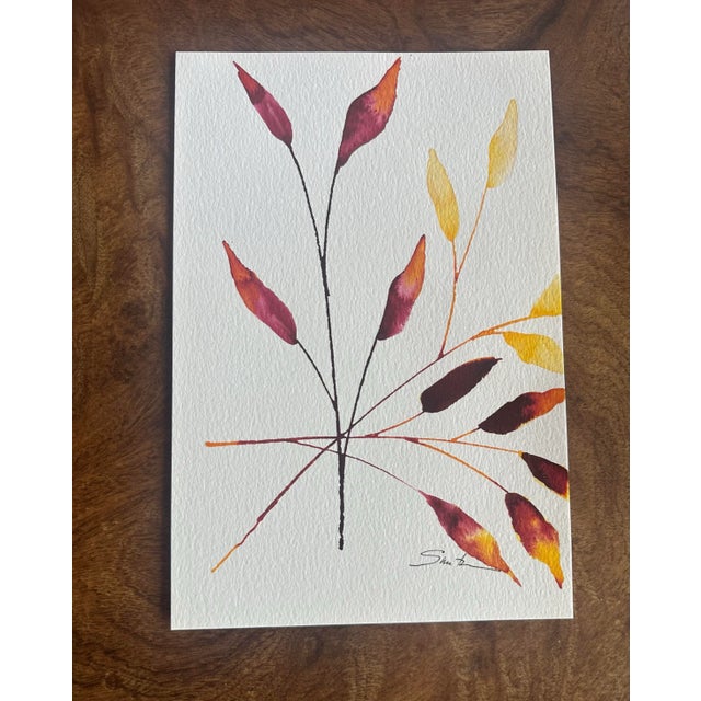 Linear stems branch out like a fan, each leaf washed in sunset tones of coral, magenta and yellow, an airy composition...