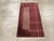 A vintage Chinese Art Deco throw rug handmade during the mid-20th century. Measures: 2' 0" x 3' 10".