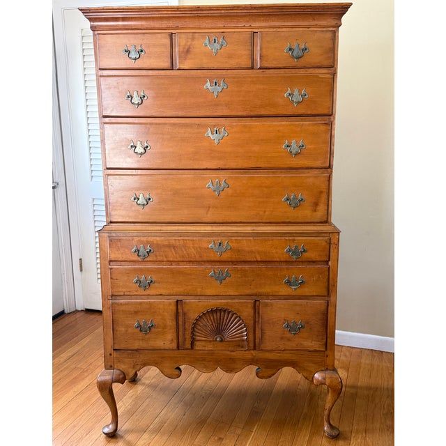 Circa mid 1700s, this two-piece maple Early American highboy chest on chest with cabriole legs has early dovetail and peg...