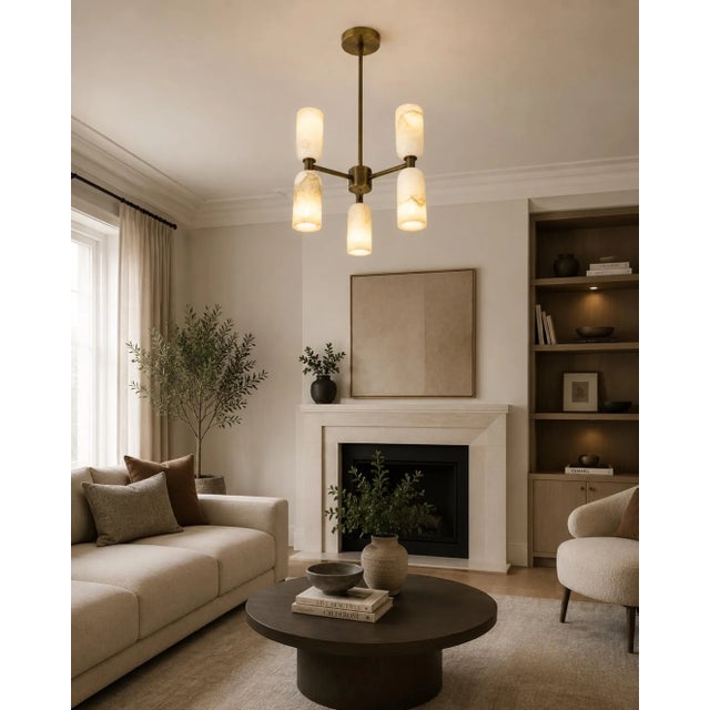 Bring natural stone texture and sculptural form to your interior with this handcrafted brass 6-light chandelier, featuring...