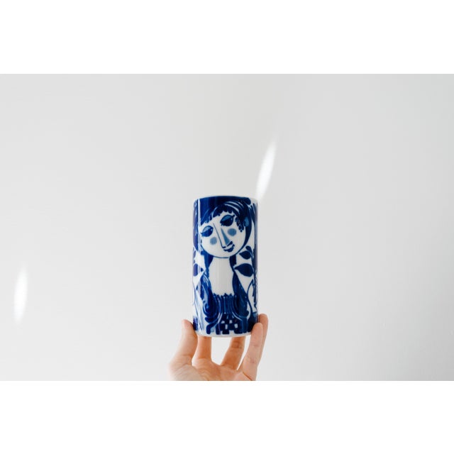 Gorgeous Mid Century white and blue glazed porcelain vase expertly created by artist Bjørn Wiinblad for Rosenthal Germany....