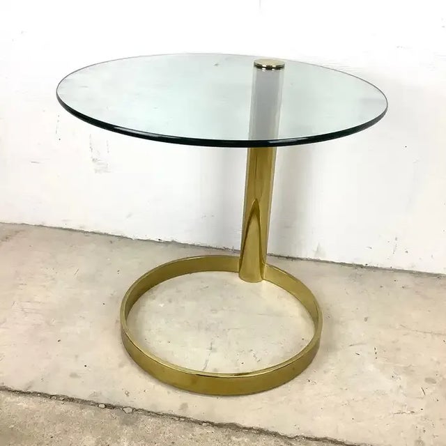 Stunning Leon Rosen style glass top cantilever end table. This table has a design that was made popular in the mid-century...