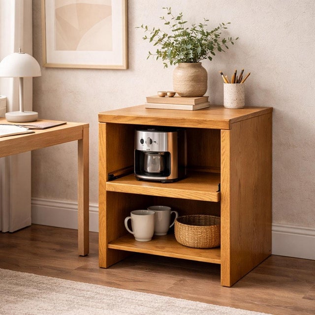 Late 20th-century solid oak media cabinet with a pull-out shelf and compact architectural form. Built in warm, honey-toned...