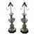 An elegant pair of vintage pewter candlestick table lamps featuring sculptural, baluster-form bodies mounted on...