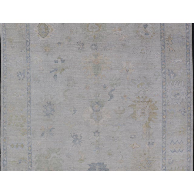 Modern Tribal Oushak With a Cream Border and Light Gray-Blue Background For Sale - Image 11 of 13