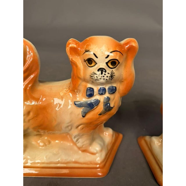 A charming pair of 19th-century Staffordshire King Charles Spaniel figures dating to circa 1870. These antique English...