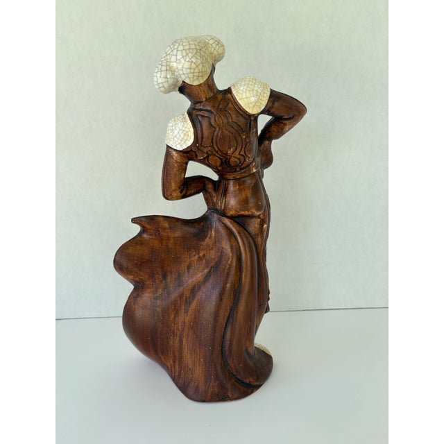 This striking vintage ceramic figurine set depicts a dramatic Spanish bullfighting scene featuring a poised matador and a...