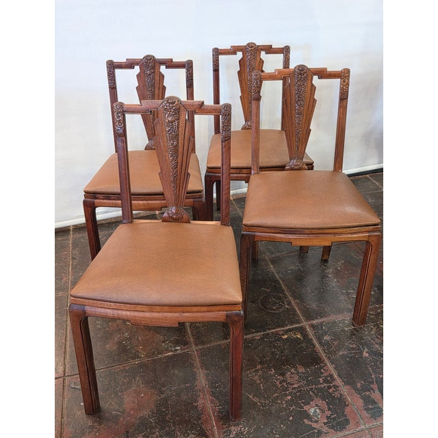 A wonderful hand made hand carved set 4 walnut French Art Deco Dining Chairs with Asian Motifs. Art Deco meets Chinese...