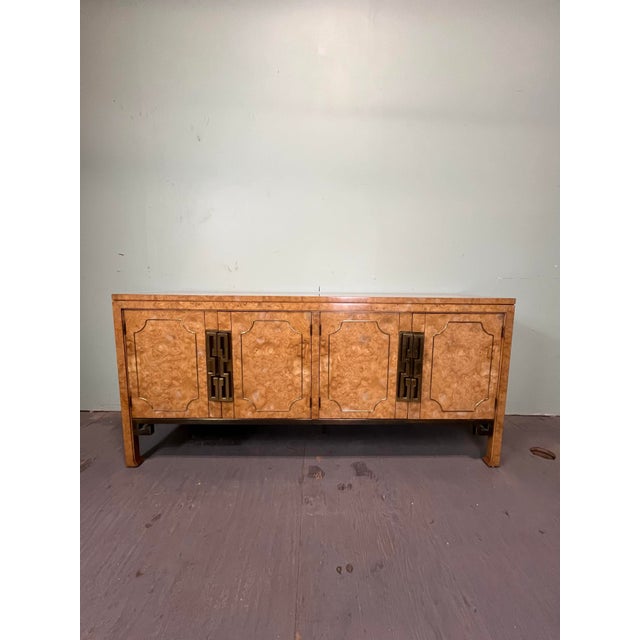 A gorgeous Mid-Century Modern Hollywood Regency sideboard, credenza, or bar cabinet. Terrific ash burl grain. By William...