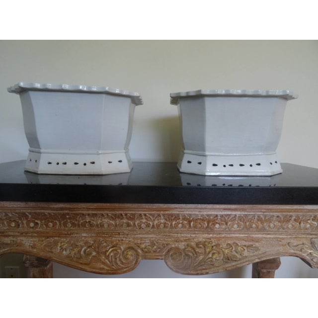An unusual pair of vintage china cache pots or planters in Blanc de China porcelain.