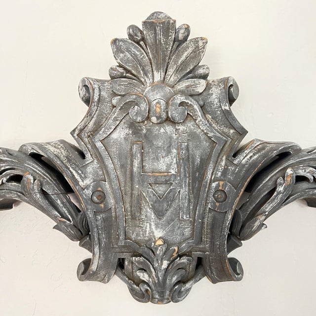 Enhance your living space with the exquisite craftsmanship of our Hand-Carved Gray Wood Architectural Wall Plaque. This...