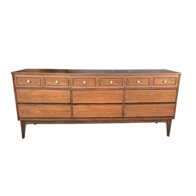 This 1960s Mid-Century walnut chest of drawers has been fully restored and presents beautifully in a warm light walnut...