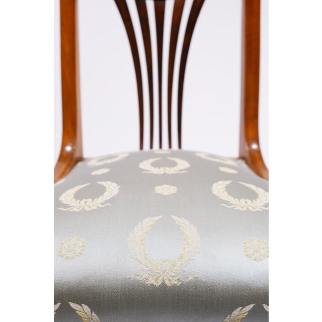 Pair of Fine Cherry Neo Classical Biedermeier Side Chairs Covered in French Silk in a pale blue with gold laurel wreath...