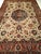 "An early 20th-century Persian Tabriz rug, room-sized and richly adorned with a grand botanical design reminiscent of...