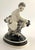 Very rare antique Austrian ART NOUVEAU figurine of a putto riding a rooster with flower garlands, crafted by the Wiener...