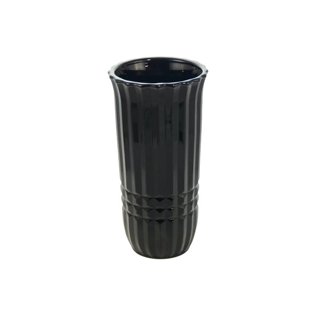 Black amethyst glass vase, dark purple when backlit, with art deco style deep fluted texture and a scallop rim. Marked...