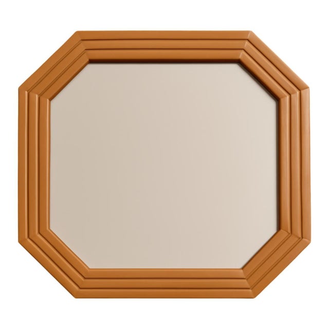This vintage octagonal wall mirror is a striking study in geometric form and natural warmth. Likely originating from the...