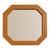 This vintage octagonal wall mirror is a striking study in geometric form and natural warmth. Likely originating from the...