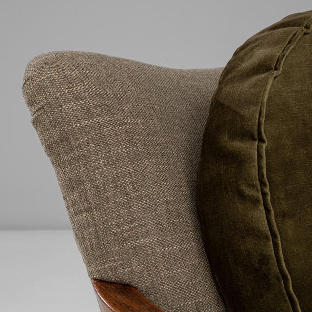 This 1940s Danish pair of Art Deco upholstered armchairs exemplifies mid-century craftsmanship with a distinctly...